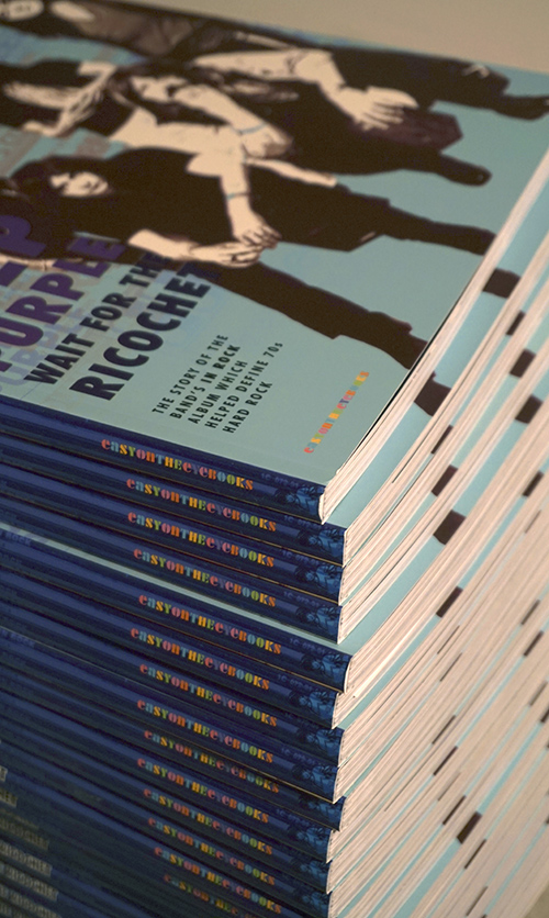 pile of books in office.jpg